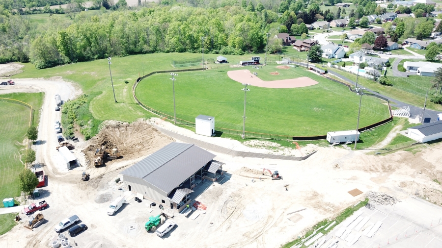 wide angle of a new construction with a baseball diamond